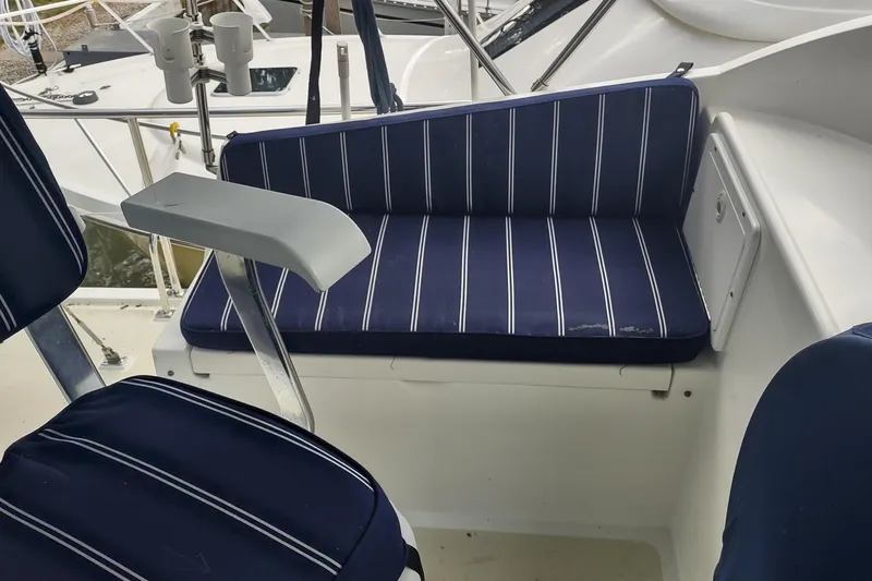 Slide: The Image of Blue-striped seating on a 2001 Kadey-Krogen 39 boat deck. - 26