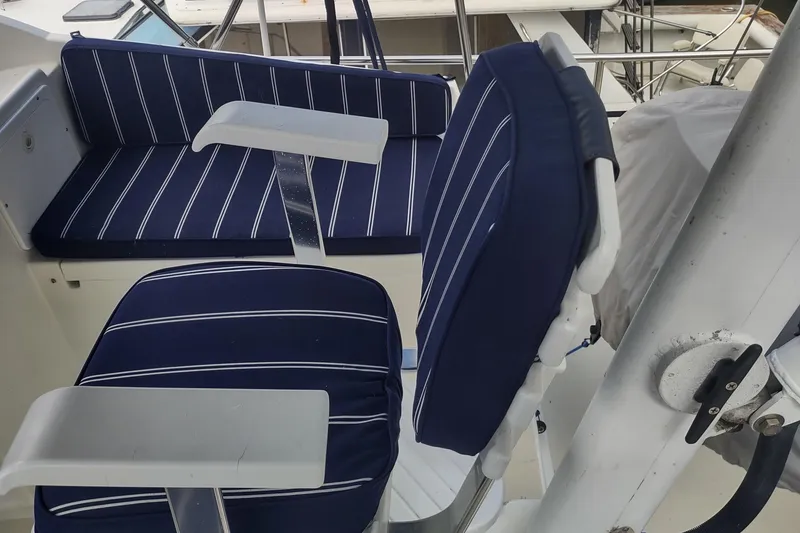 Slide: The Image of Blue striped seating on 2001 Kadey-Krogen 39 boat deck. - 27