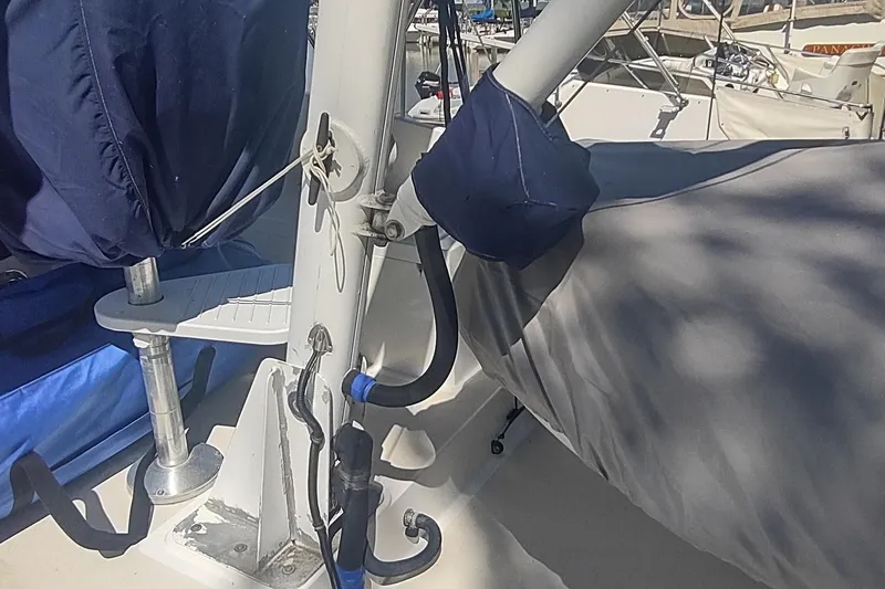 Slide: The Image of Deck details of a 2001 Kadey-Krogen 39 boat with covered equipment. - 28