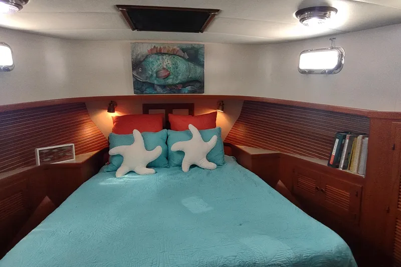 Slide: The Image of Cozy bedroom in 2001 Kadey-Krogen 39 yacht with starfish pillows and ocean-themed decor. - 3