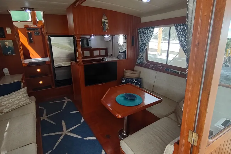 Slide: The Image of Interior of 2001 Kadey-Krogen 39 yacht with cozy seating and nautical decor. - 30