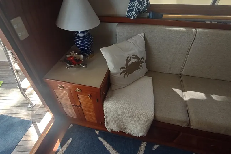 Slide: The Image of Cozy interior of 2001 Kadey-Krogen 39 with crab-themed decor and nautical elements. - 32