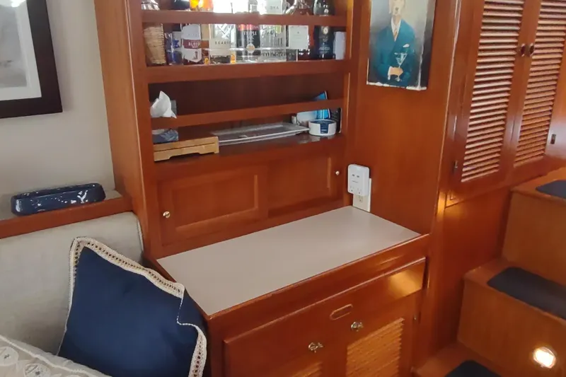 Slide: The Image of Interior of 2001 Kadey-Krogen 39 yacht with wooden cabinetry and shelves. - 33