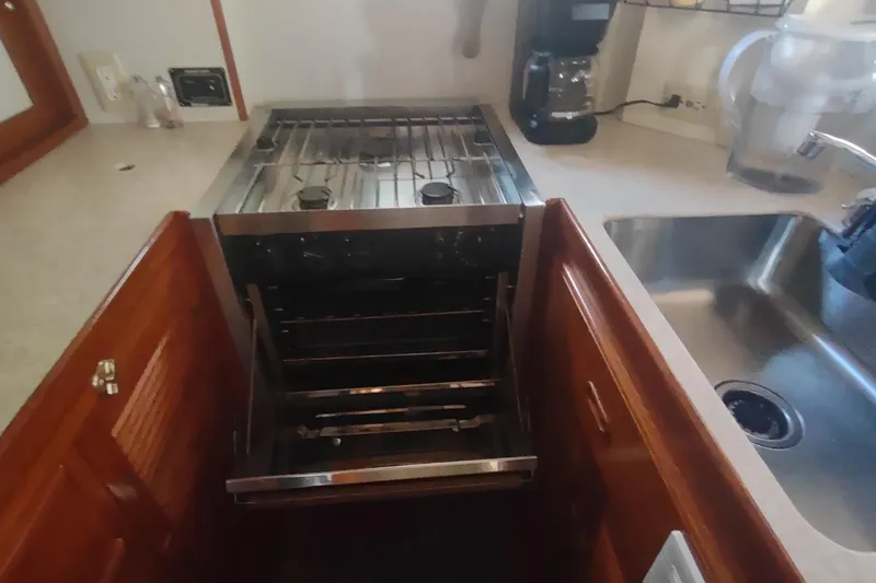 Slide: The Image of Galley kitchen in 2001 Kadey-Krogen 39 yacht with stove and sink. - 34