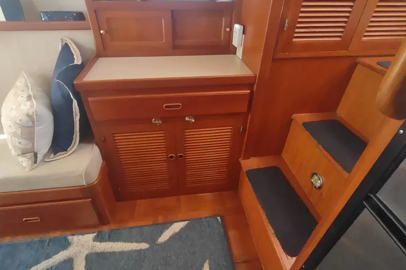 Slide: The Image of Interior of 2001 Kadey-Krogen 39 yacht with wooden cabinetry and stairs. - 39