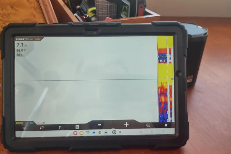 Slide: The Image of Tablet displaying sonar data on Kadey-Krogen 39, 2001 model, with depth and temperature readings. - 47