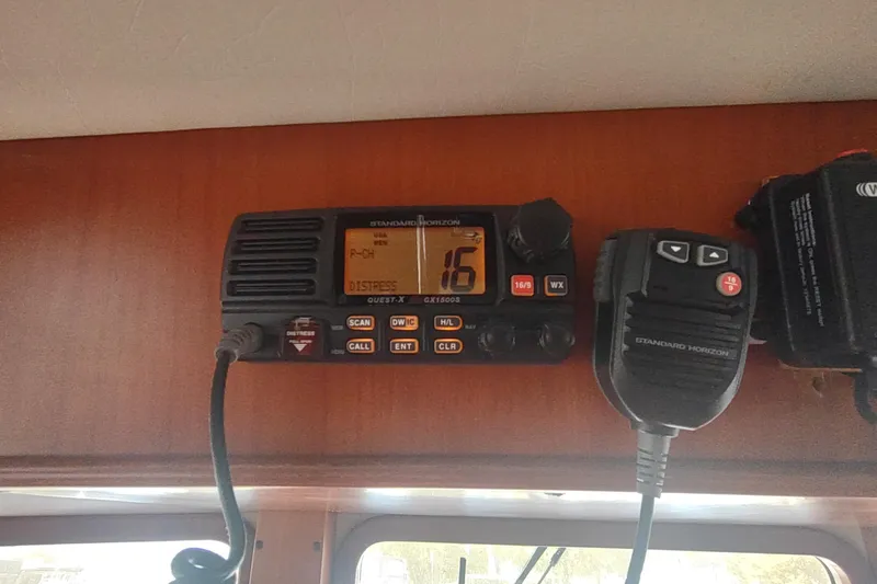 Slide: The Image of VHF radio on 2001 Kadey-Krogen 39, displaying channel 16 for distress communication. - 49