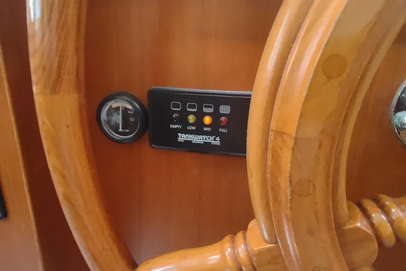 Slide: The Image of Wooden helm and tank level monitor on 2001 Kadey-Krogen 39 yacht. - 54