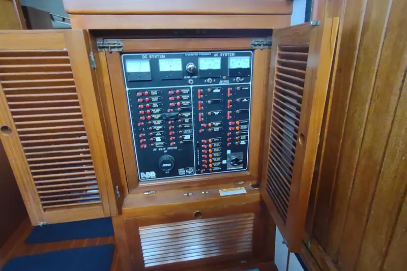 Slide: The Image of Electrical panel inside a 2001 Kadey-Krogen 39 boat, featuring DC and AC systems. - 59