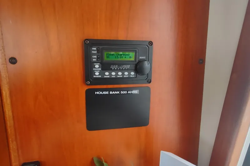 Slide: The Image of Control panel on 2001 Kadey-Krogen 39 boat, displaying battery status and settings. - 60