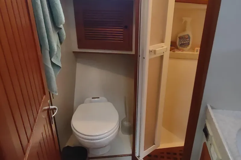 Slide: The Image of Bathroom interior of 2001 Kadey-Krogen 39 yacht with toilet and shower. - 62