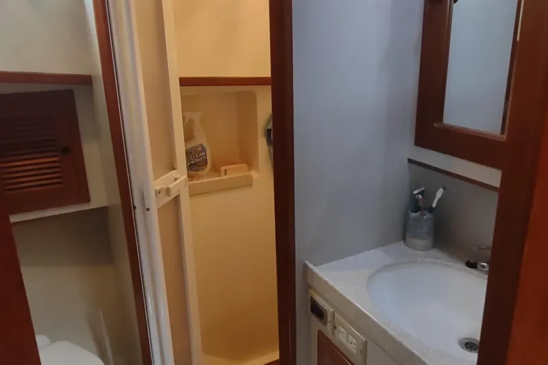 Slide: The Image of Bathroom interior of 2001 Kadey-Krogen 39 yacht, featuring sink and shower area. - 63