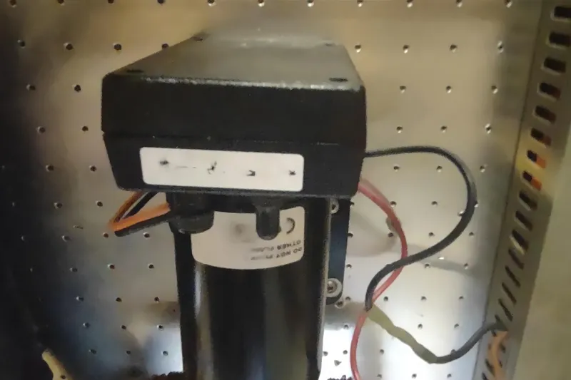 Slide: The Image of Electrical component inside a 2001 Kadey-Krogen 39 boat, featuring wires and connectors. - 78