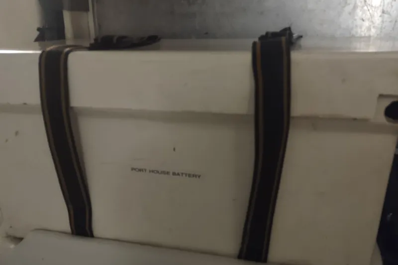 Slide: The Image of Port house battery in 2001 Kadey-Krogen 39 boat, secured with straps. - 79