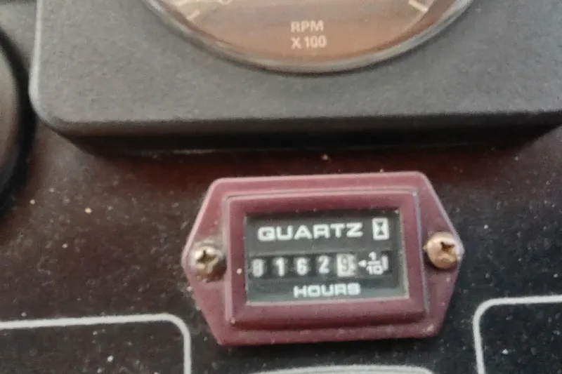 Slide: The Image of Hour meter reading 8162.9 on 2001 Kadey-Krogen 39 boat dashboard. - 85