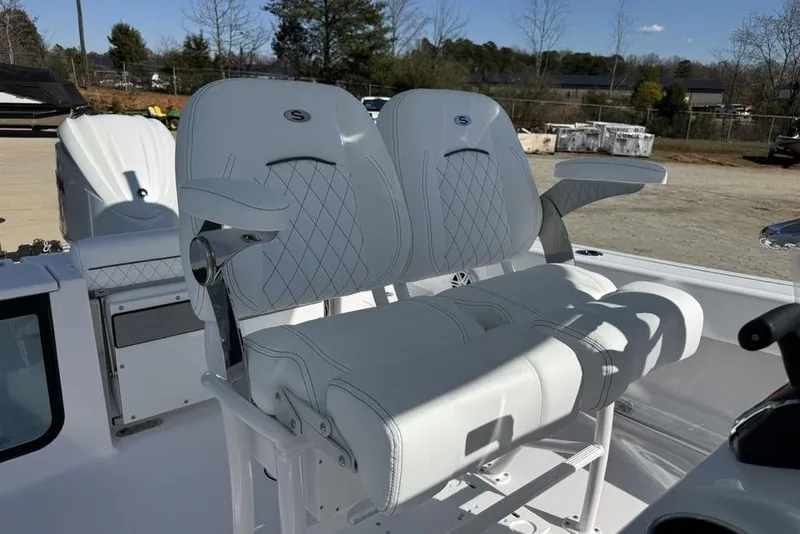 Slide: The Image of 2026 Sportsman Open 232 Center Console boat with white cushioned seating. - 10