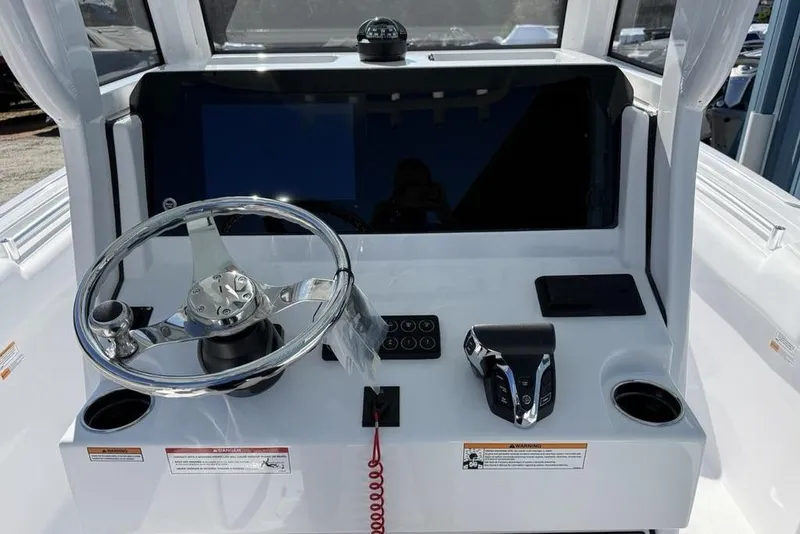 Slide: The Image of 2026 Sportsman Open 232 Center Console dashboard with steering wheel and controls. - 11