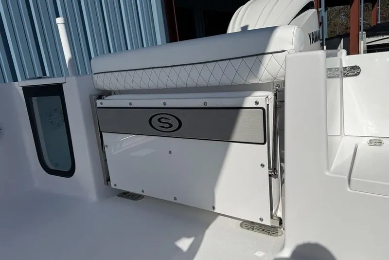Slide: The Image of 2026 Sportsman Open 232 Center Console boat interior with seating and storage. - 13