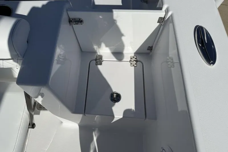 Slide: The Image of 2026 Sportsman Open 232 Center Console boat interior with storage compartment. - 19