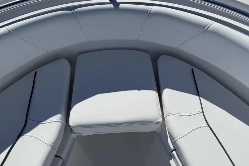 Slide: The Image of 2026 Sportsman Open 232 Center Console boat interior with cushioned seating. - 2