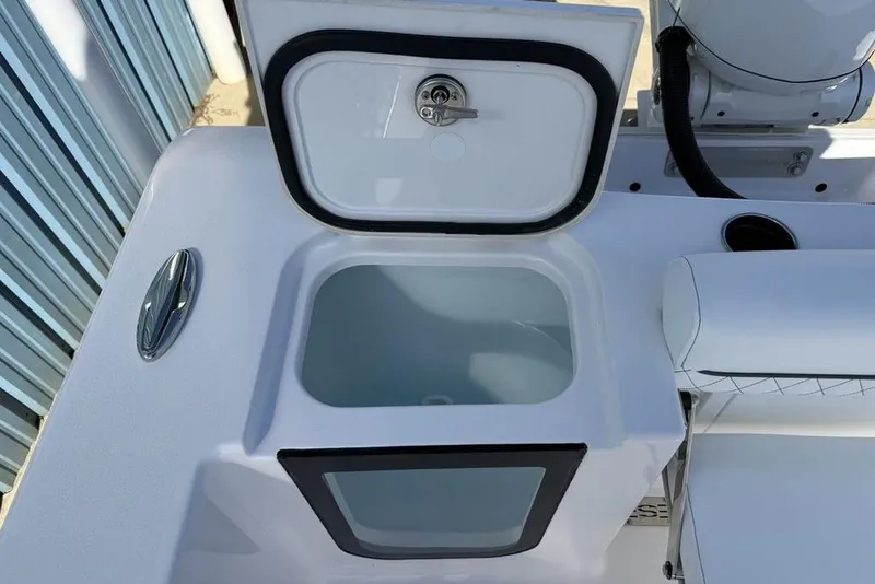 Slide: The Image of 2026 Sportsman Open 232 Center Console boat with open storage compartment. - 24