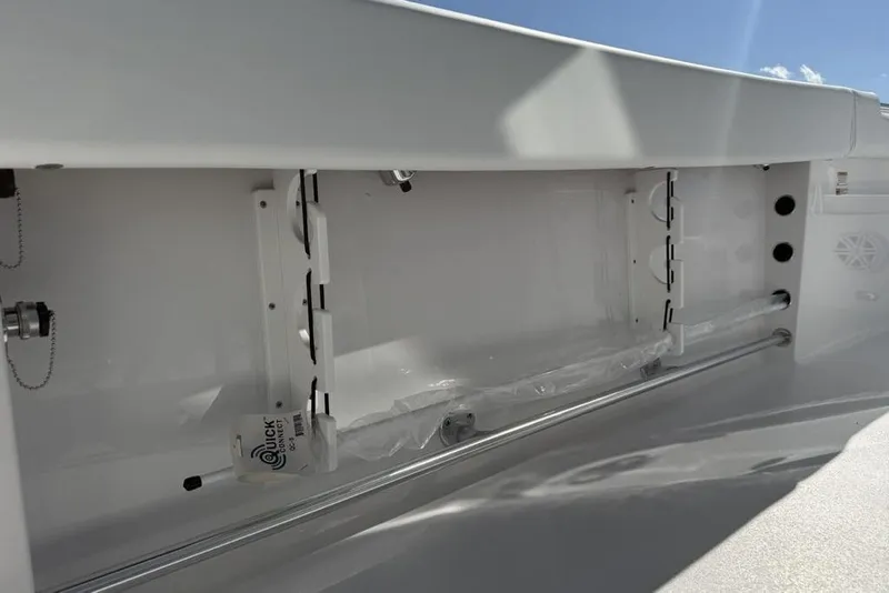 Slide: The Image of 2026 Sportsman Open 232 Center Console interior detail with storage compartment and fixtures. - 25