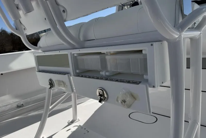 Slide: The Image of 2026 Sportsman Open 232 Center Console boat storage compartments and seating detail. - 27