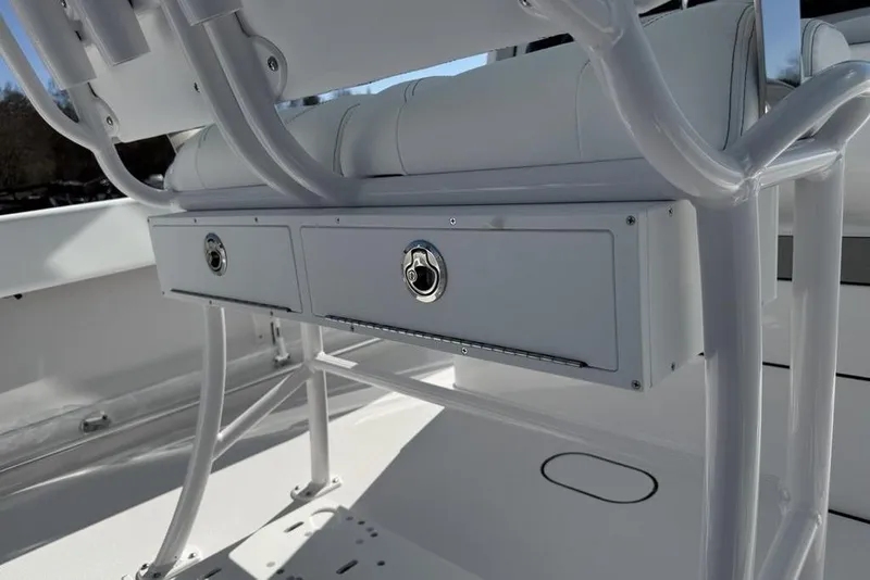 Slide: The Image of 2026 Sportsman Open 232 Center Console boat storage compartments and seating detail. - 29