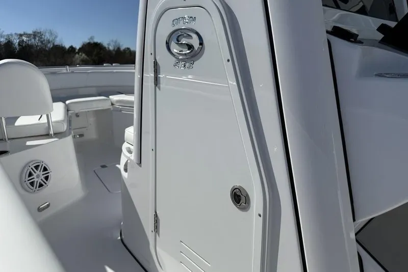Slide: The Image of 2026 Sportsman Open 232 Center Console boat interior, featuring sleek white design and seating. - 30