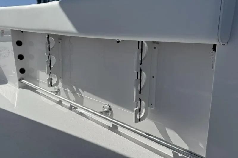 Slide: The Image of 2026 Sportsman Open 232 Center Console boat interior detail with rod holders. - 32