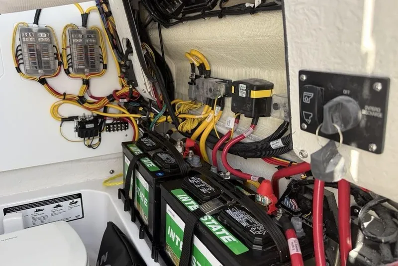 Slide: The Image of Electrical system of 2026 Sportsman Open 232 Center Console boat with batteries and wiring. - 35