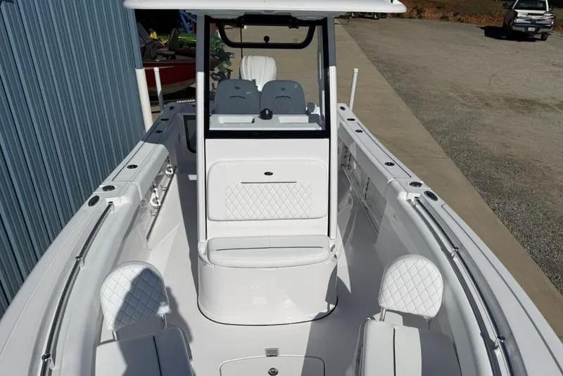 Slide: The Image of 2026 Sportsman Open 232 Center Console boat with sleek white interior design. - 7