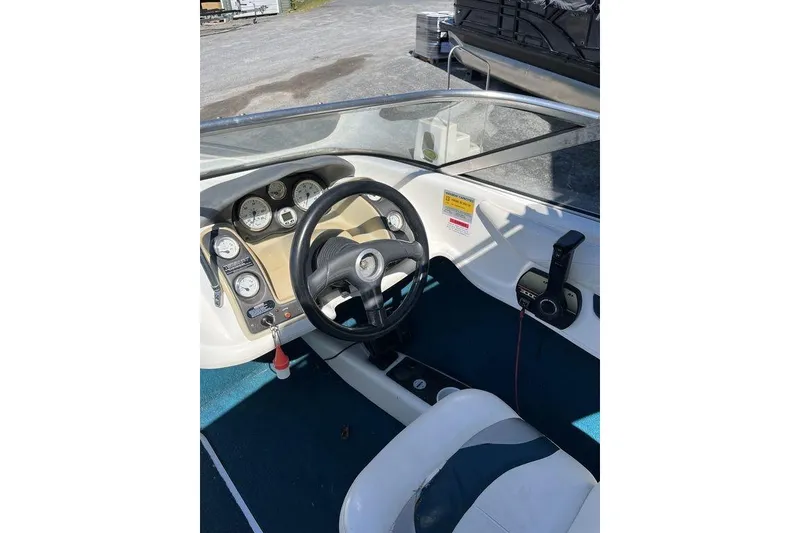 Slide: The Image of Dashboard of a 2000 Larson SEI226 boat with speedometer and gauges. - 11