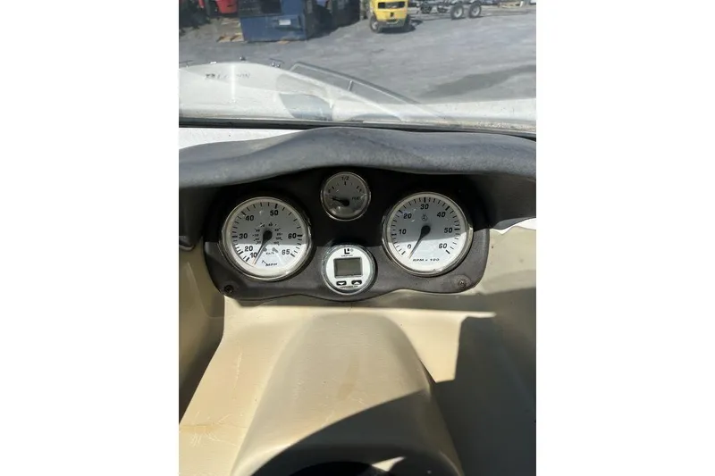Slide: The Image of Hour meter on 2000 Larson SEI226 boat dashboard showing elapsed time. - 12