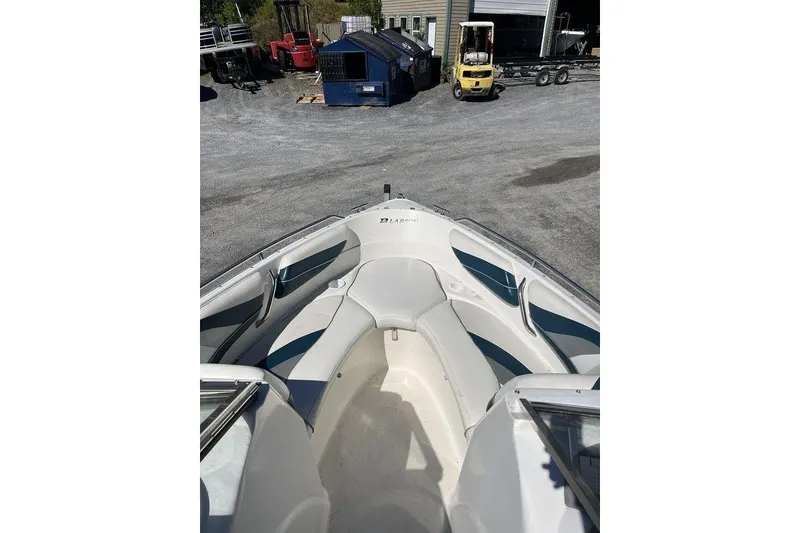 Slide: The Image of Boat dashboard with Humminbird fish finder on Larson SEI226, 2000 model, blue carpet background. - 15