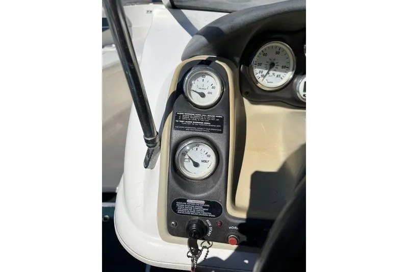 Slide: The Image of Dashboard gauges of a 2000 Larson SEI226 boat in sunlight. - 8
