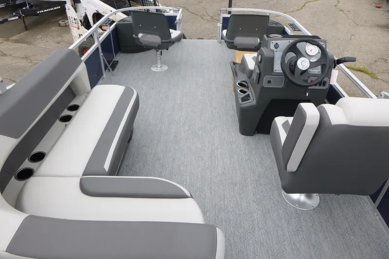 Slide: The Image of 2026 Sun Tracker Bass Buggy 18 DLX interior with seating and steering console. - 5