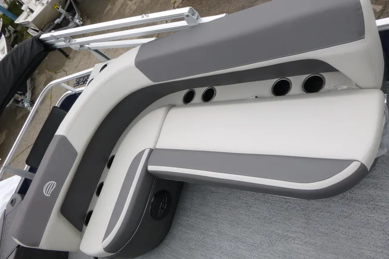 Slide: The Image of 2026 Sun Tracker Bass Buggy 18 DLX boat seating, featuring gray and white cushioned design. - 9
