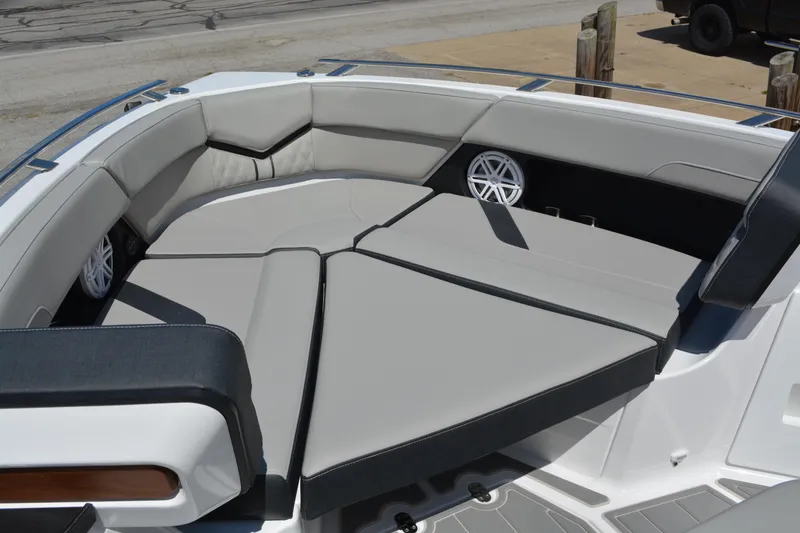 Slide: The Image of 2026 Monterey Elite 30 OB boat with spacious, cushioned seating and integrated speakers. - 10