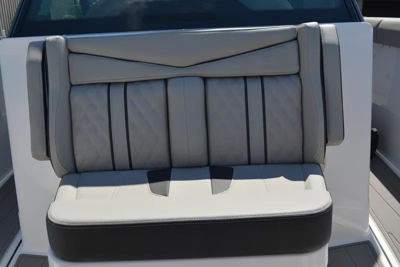 Slide: The Image of Luxurious seating on 2026 Monterey Elite 30 OB boat, featuring elegant gray upholstery. - 11