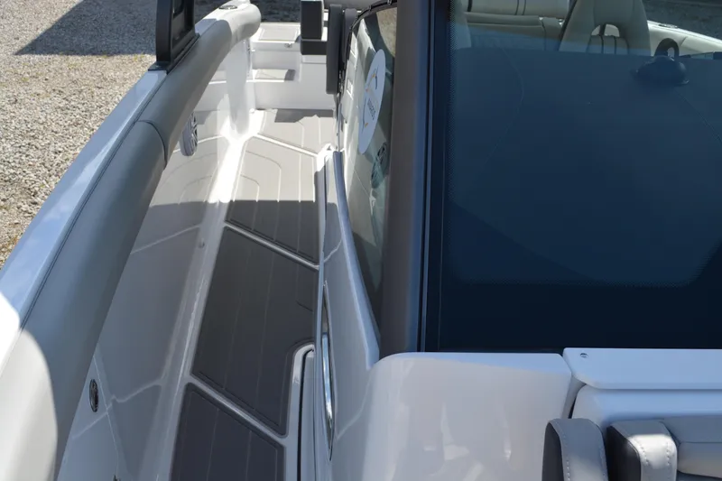 Slide: The Image of 2026 Monterey Elite 30 OB boat interior with sleek seating and modern design. - 17