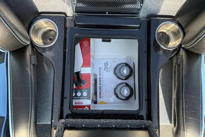 Slide: The Image of Interior of 2026 Phoenix 20 XE with storage compartment and cup holders. - 19