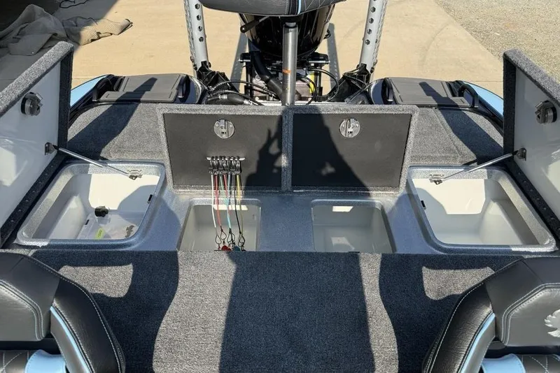 Slide: The Image of 2026 Phoenix 20 XE boat interior with open storage compartments and wiring. - 23