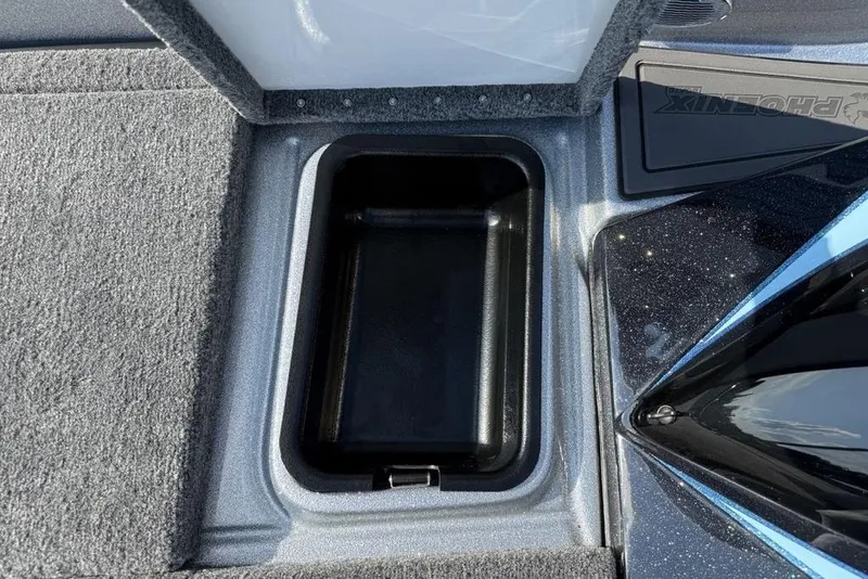 Slide: The Image of Storage compartment in 2026 Phoenix 20 XE boat, featuring carpeted interior and sleek design. - 7