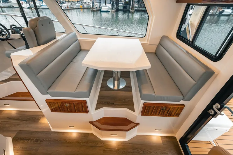 Slide: The Image of Luxurious interior of 2025 Lindell 48' yacht with elegant seating and waterfront view. - 11