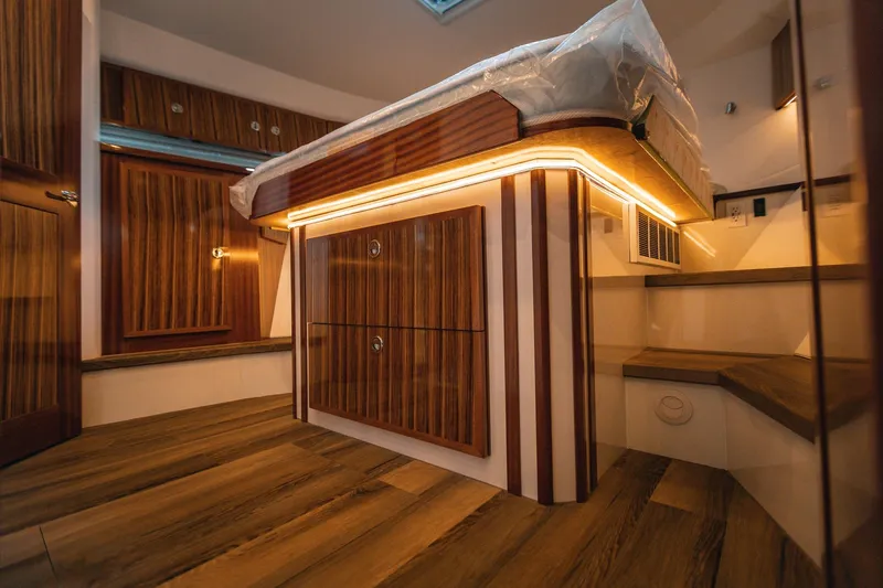 Slide: The Image of Luxurious interior of 2025 Lindell 48' yacht with wood paneling and ambient lighting. - 19