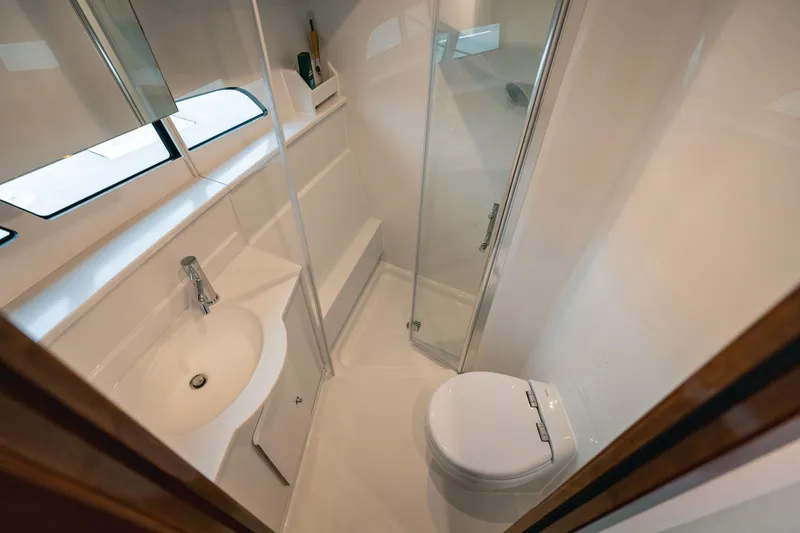 Slide: The Image of Modern bathroom in 2025 Lindell 48' yacht with shower, sink, and toilet. - 20