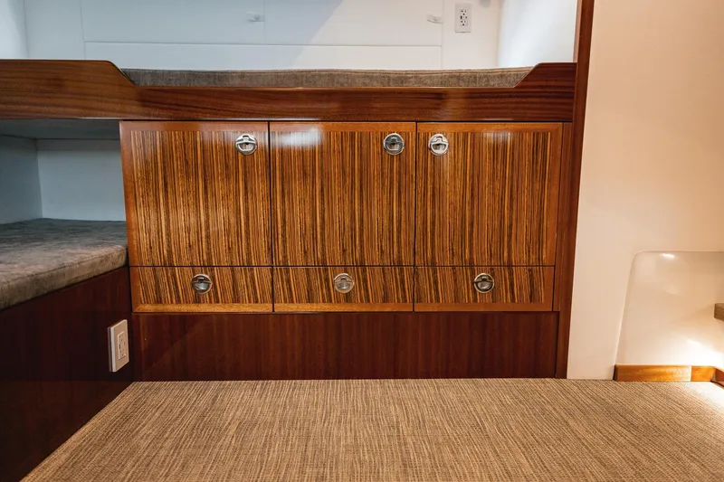 Slide: The Image of Luxurious wood cabinetry in 2025 Lindell 48' yacht interior. - 23