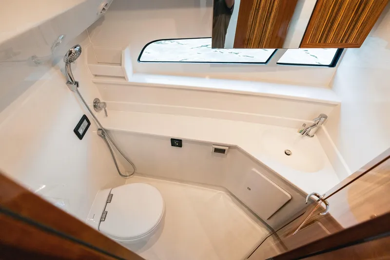 Slide: The Image of Modern bathroom in 2025 Lindell 48' yacht with shower, toilet, and sink. - 27