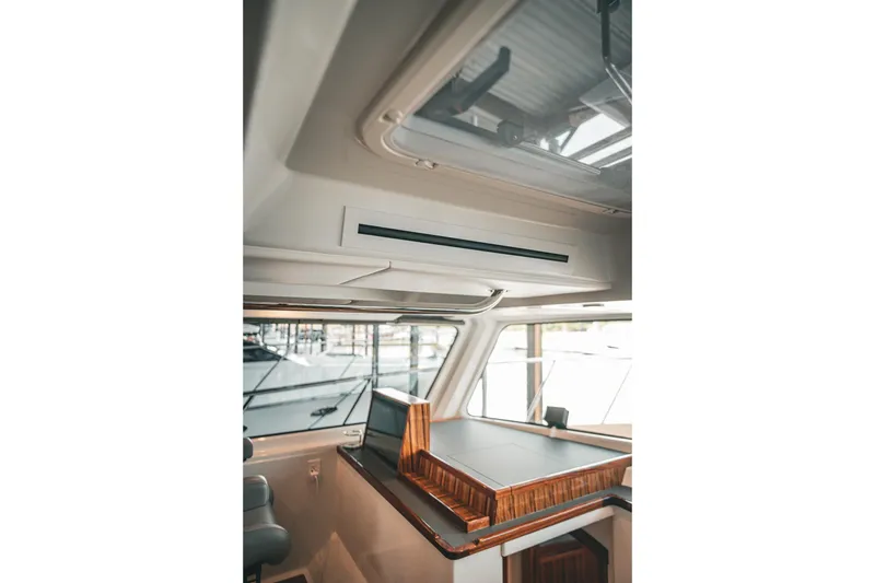 Slide: The Image of Interior of 2025 Lindell 48' yacht showcasing sleek design and modern navigation station. - 29